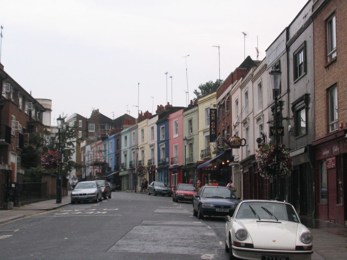 Pastel houses and market stalls on Portobello Road in Notting Hill, a stop on a 5 days in London itinerary