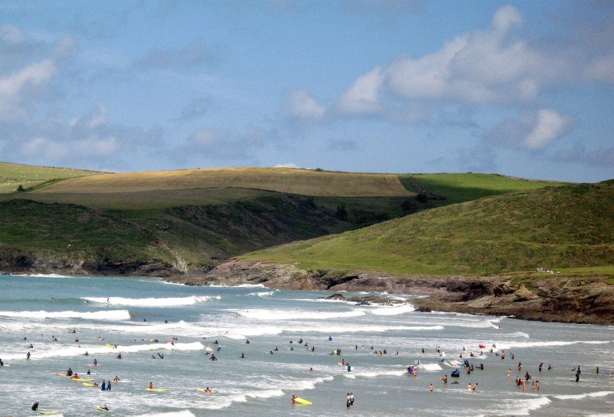 Wide sandy Polzeath beach with families and small surf, one of the best Cornwall beaches for families