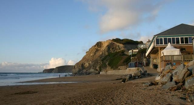 Surfers and wide sand at Watergate Bay on the north coast of Cornwall