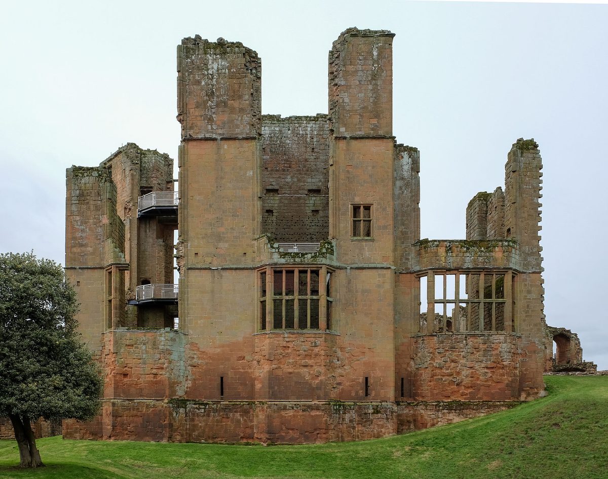 The red sandstone ruins of Kenilworth Castle glowing in late afternoon light in Warwickshire
