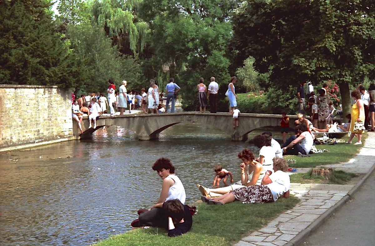 Low stone footbridges over the River Windrush at Bourton-on-the-Water on a quiet morning