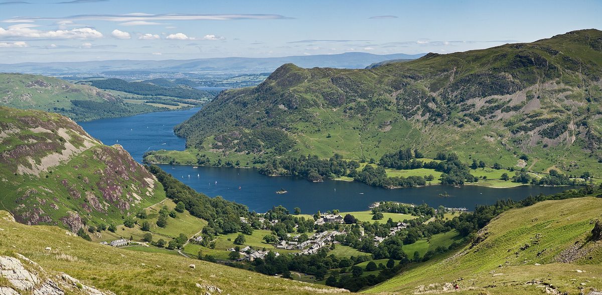 An Ullswater Steamer crossing the lake below the fells near Glenridding in the Lake District