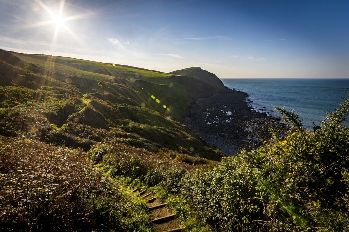 Sunny Cornwall beach and rugged coast in summer