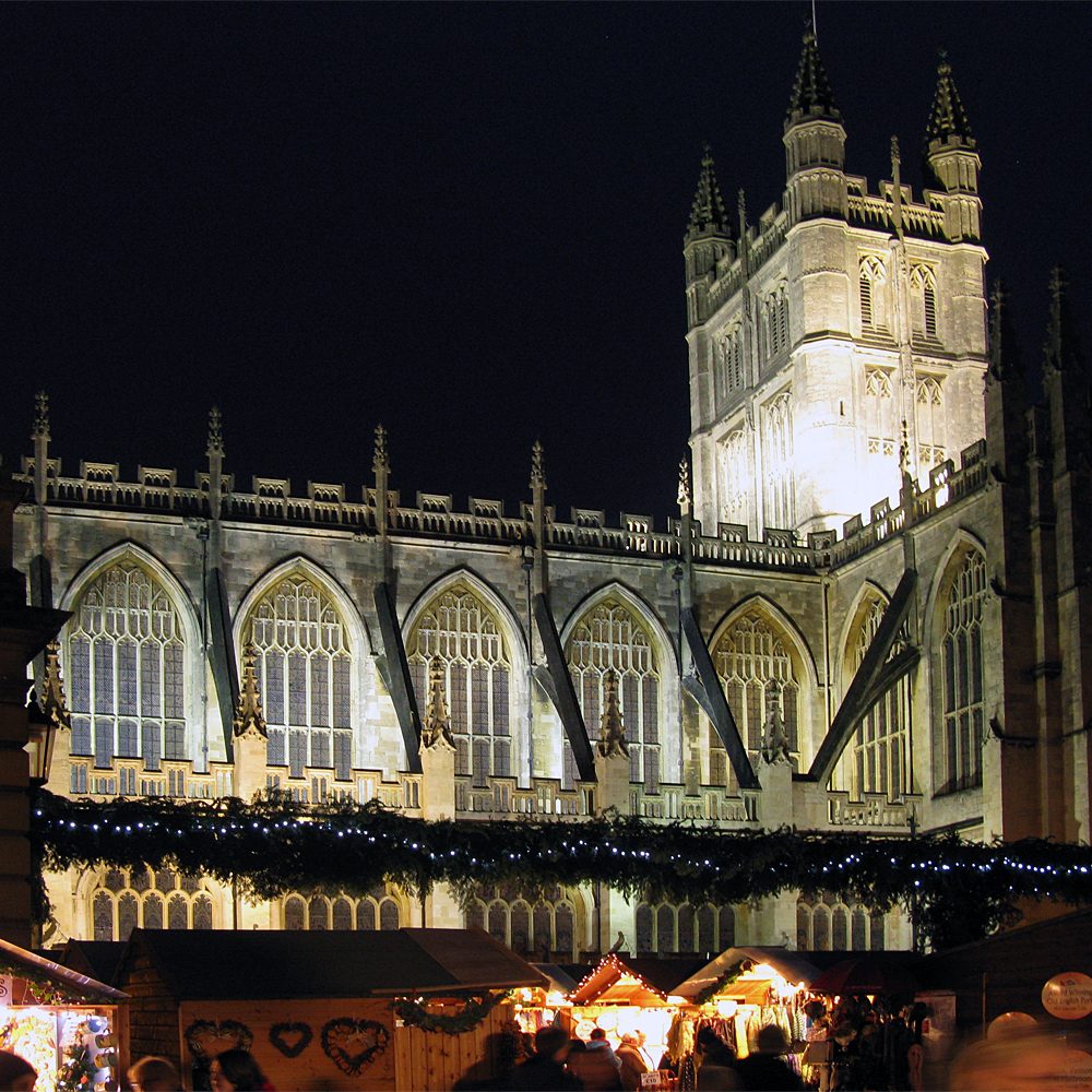 Festive stalls and lights at the Bath Christmas Market, a highlight of spending Christmas in England