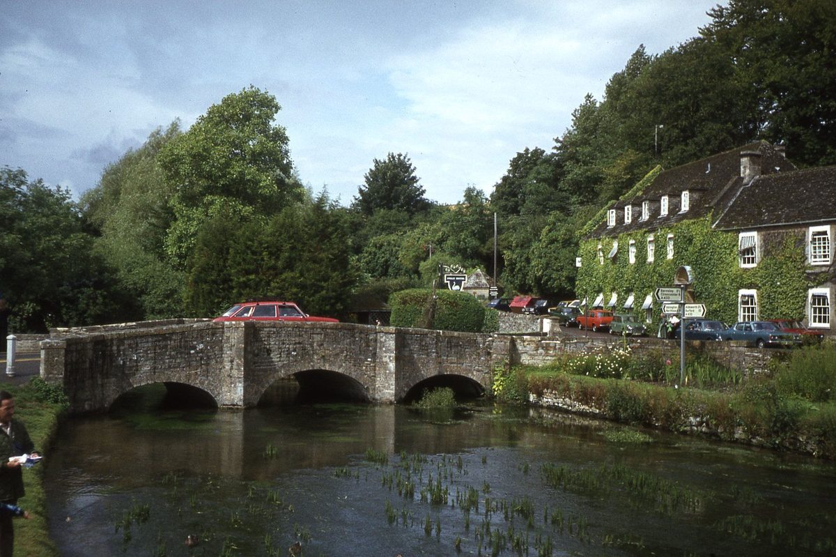 The River Coln winding past Arlington Row cottages and the old water meadow at Bibury