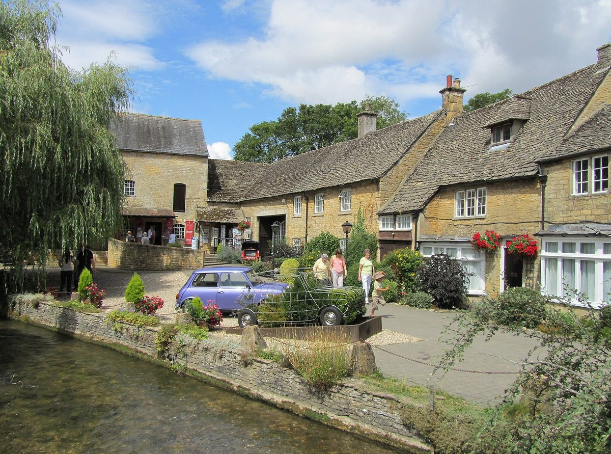 The willow-lined River Windrush running through the centre of Bourton-on-the-Water