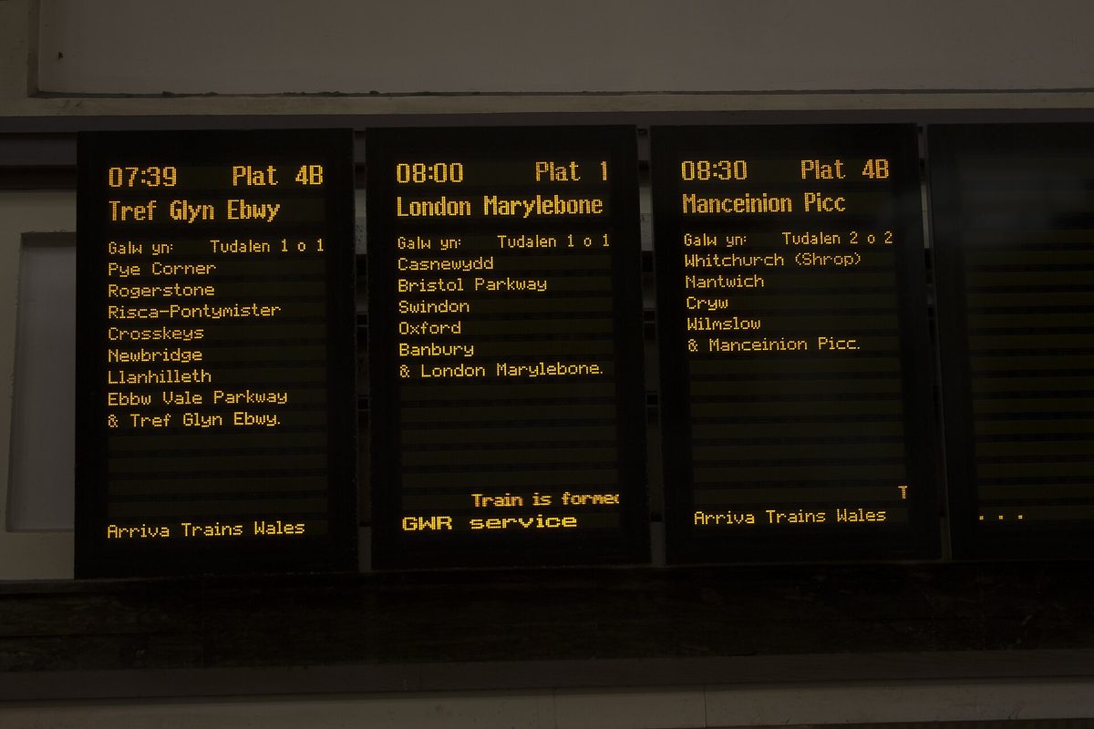 Departure boards at London Paddington station, where avoiding England travel mistakes starts with booking train tickets in advance