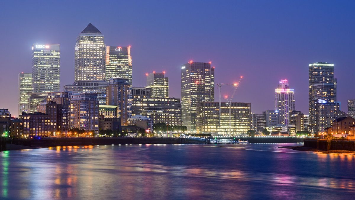 The London skyline glowing over the Thames at night — the city stays lively and watchful after dark.