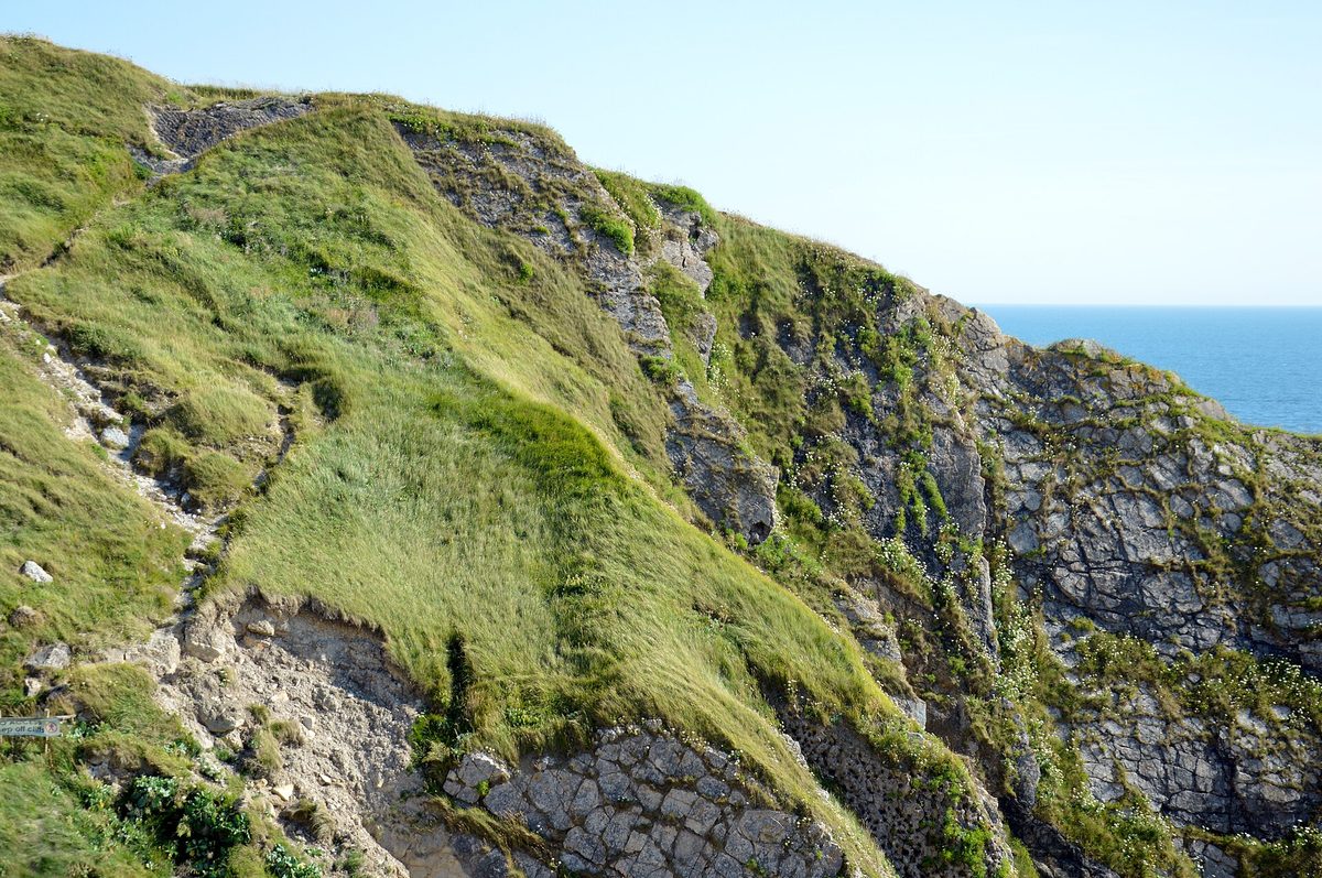 Durdle Door limestone arch on the Jurassic Coast travel guide route in Dorset, England