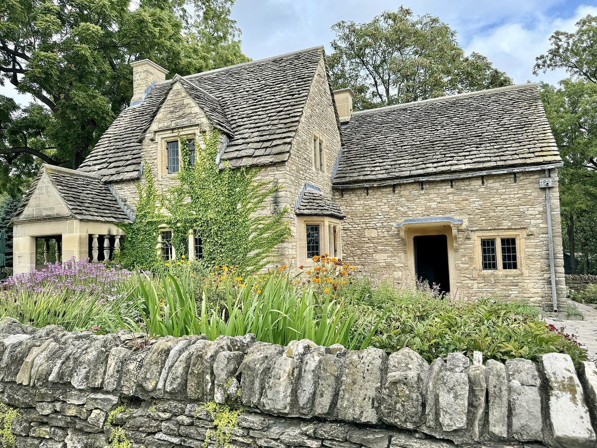 Honey-colored cottages on a quiet Cotswolds village street