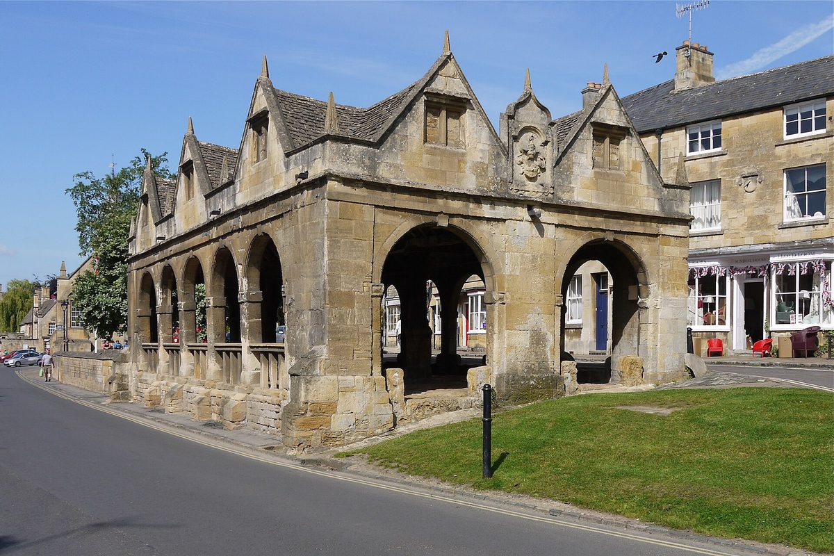 The curving golden-stone High Street of Chipping Campden, a calm base town in the Cotswolds